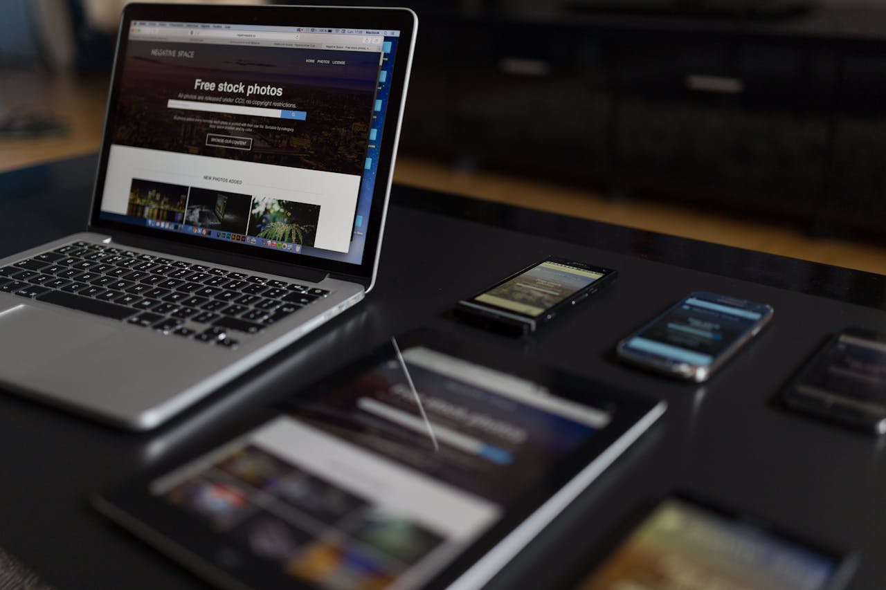 who-we-are A contemporary workspace showcasing a laptop, tablet, and smartphones, ideal for tech and freelance use.